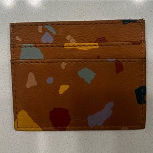 Madewell Cardholder in colored leather on brown background